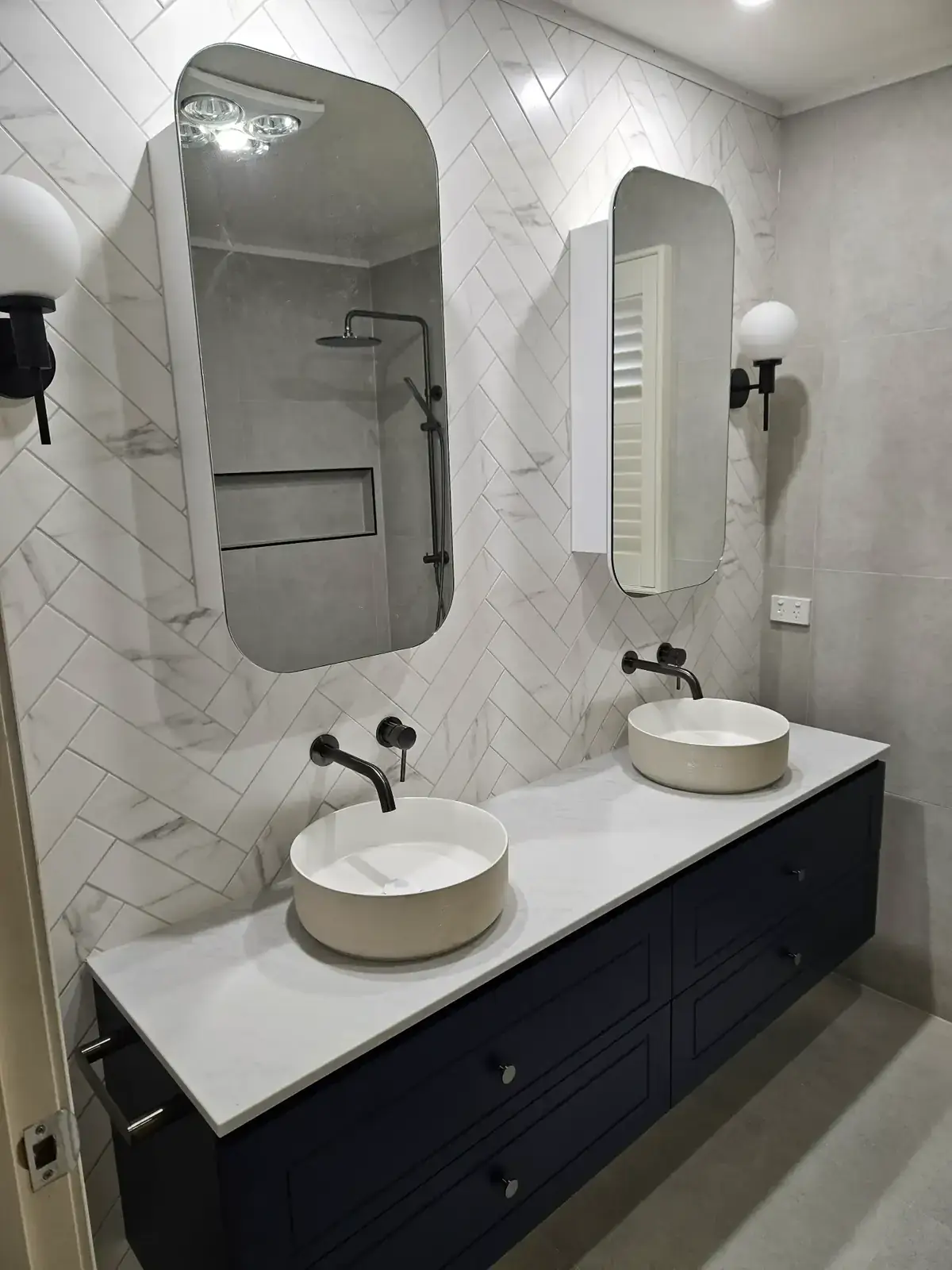 Melbourne kitchen and bathroom renovation with navy vanity and herringbone marble